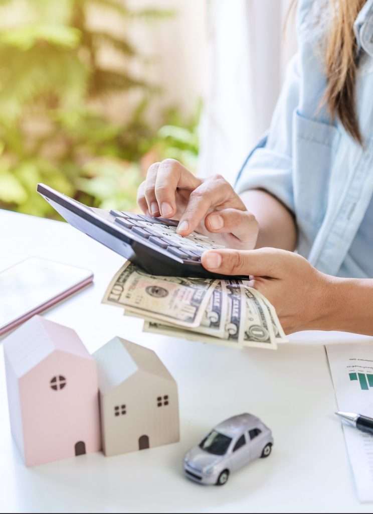 Stressed young woman calculating monthly home expenses and Car installment