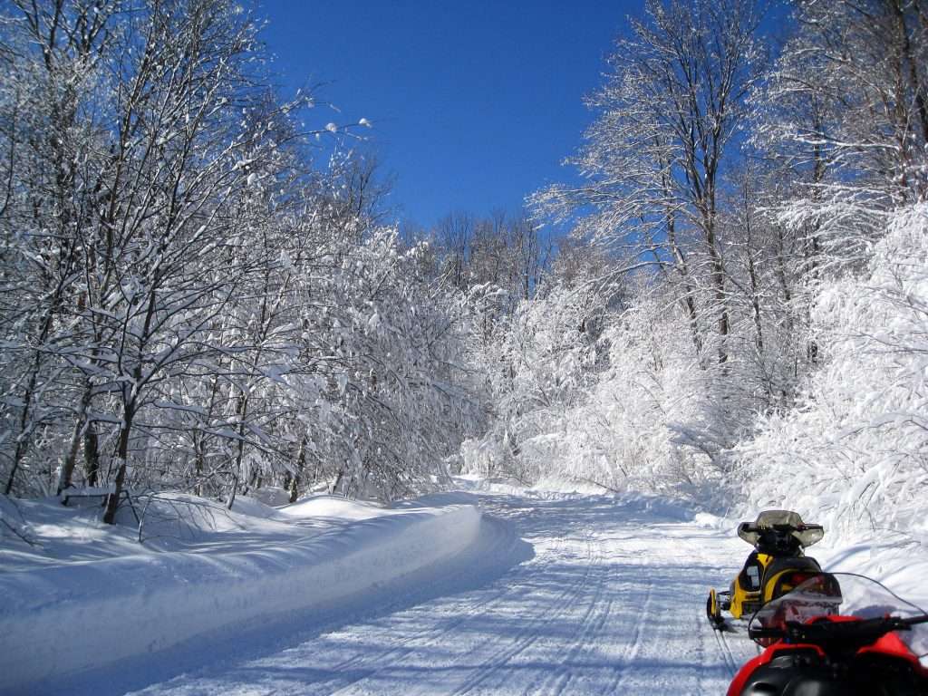Snowmobile trail in New York - stretch break off of sleds
